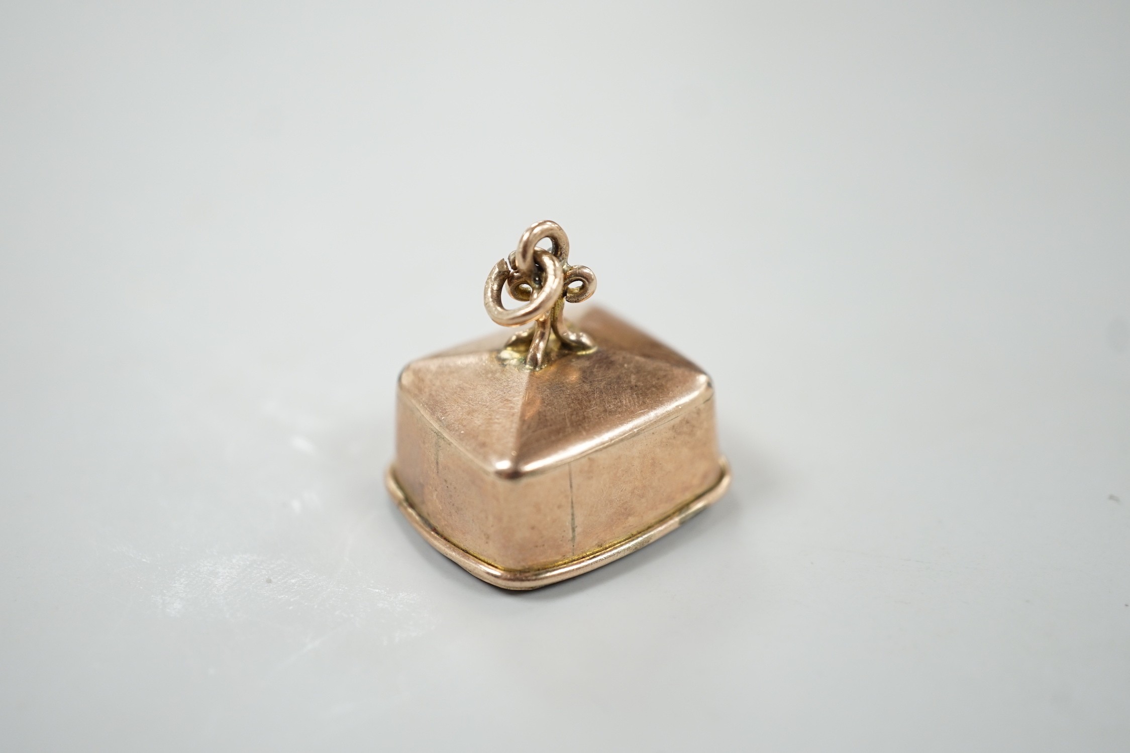 A 19th century gold plated and rock crystal? set fob seal, the matrix carved with hunting dog carrying prey, 24mm.
